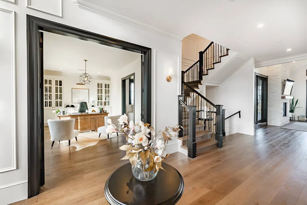 Fresh bright interior with clean white walls, crisp black trim, and warm wood accents by a painting company in Ashland, MA