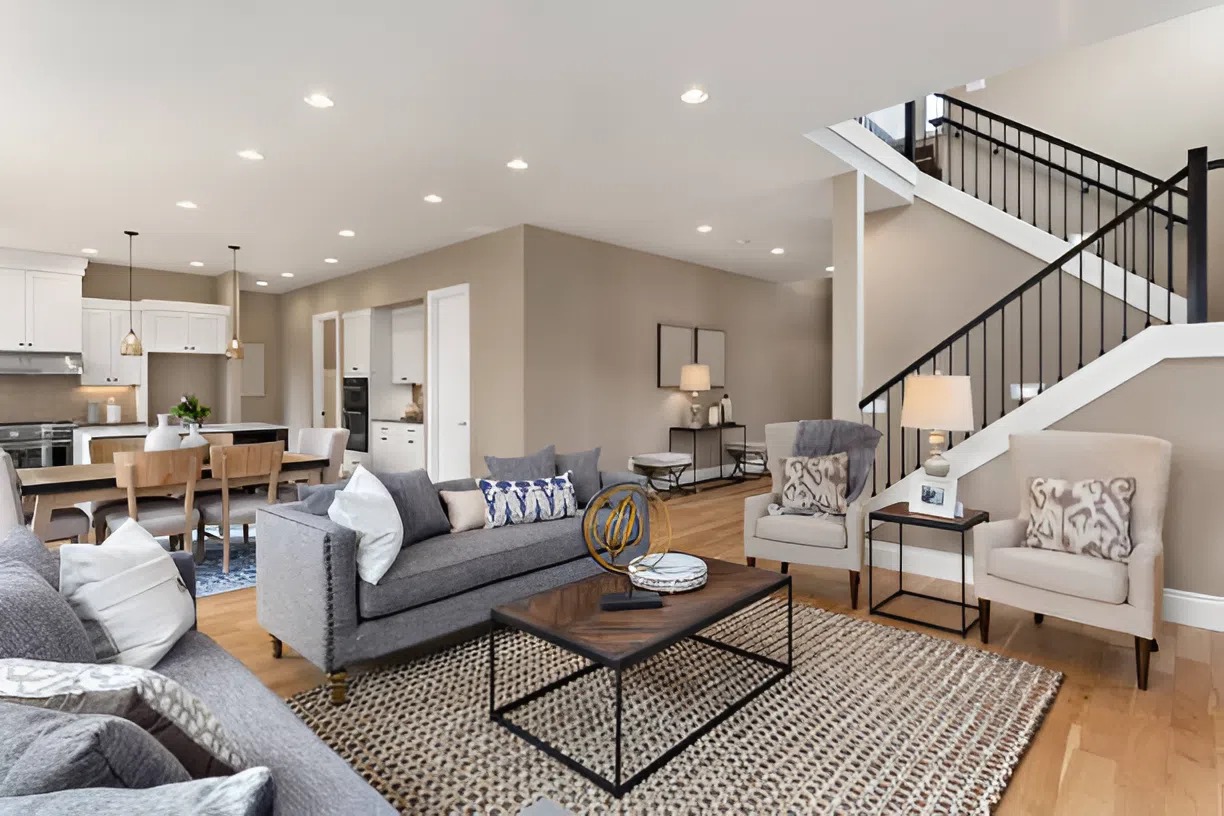 Living space with warm beige walls, crisp white trim, and a bright modern finish by a painting company in Ashland, MA
