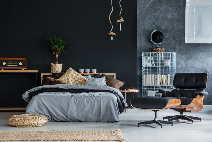 Modern black accent wall and neutral bedroom design by an interior painter in Ashland, MA