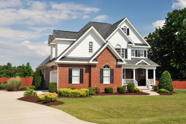 Home exterior with complementary colors and contrasting finishes by an exterior painter in Natick, MA
